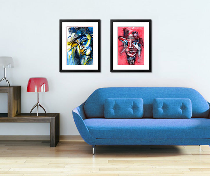 abstract face paintings in room